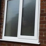 White casement windows with frosted glass