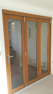 Oak coloured glass bi-fold doors