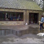 Brown window and french door installation