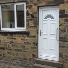 uPVC front door and white windows